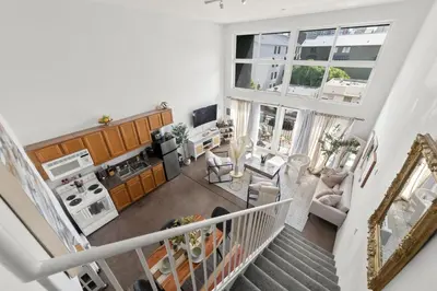an aerial view of a living room and kitchen in a house at The Italian Retreat, Little Italy in San Diego