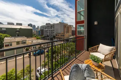 a balcony with a view of a city at The Italian Retreat, Little Italy in San Diego