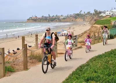 a group of people riding bikes on the beach at Convention close by 2BR Suite Free Parking in San Diego