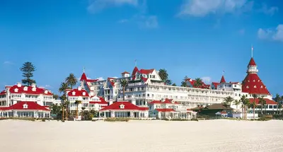a large building with red roofs on a beach at Walk to Conv Center Free Parking 4 Beds in San Diego