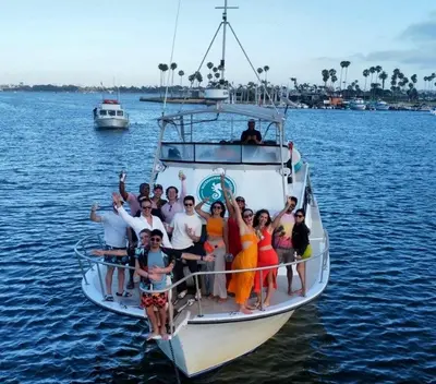 a group of people on a boat in the water at Walk to Conv Center 2BR Top Floor Parking Incl in San Diego