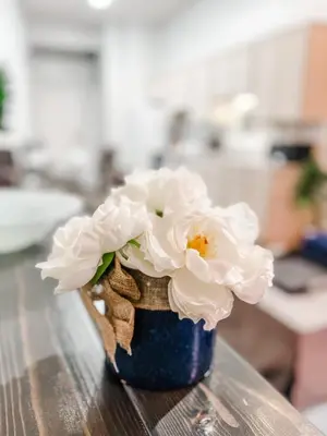 a vase filled with white flowers sitting on a table at 2BR Top Floor Suite Free Parking - Conv Center in San Diego