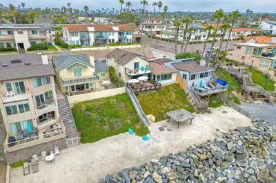 an aerial view of a house with a backyard at Oceanfront 4BR, Private Beach & Patio, Remodeled Kitchen in Oceanside