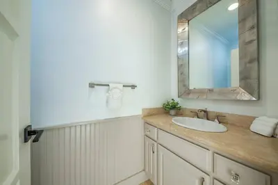 a bathroom with a sink and a mirror at 1185 Tamarack home in Carlsbad