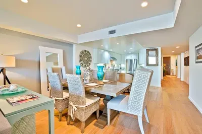 a dining room with a table and chairs at Stunning Oceanfront Getaway at Windansea Beach in San Diego