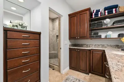 a bathroom with a vanity and a sink and a shower at 683 Just inside the gates of the Resort - Golf & Premier Fitness Guests Welcome in Encinitas