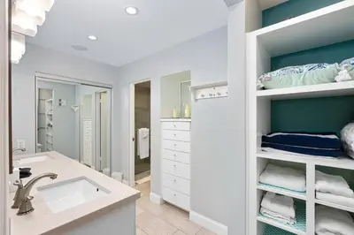 a white bathroom with a sink and a mirror at 689 - Steps to the Resort, Peaceful Studio with free Wifi & Parking in Encinitas