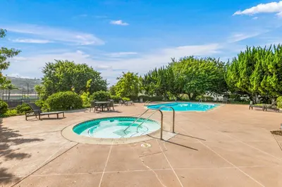 a swimming pool with a slide in a yard at 647 Luxury Inside The Gates LaCosta Resort-Top Floor Steps from Resort 647 in Encinitas