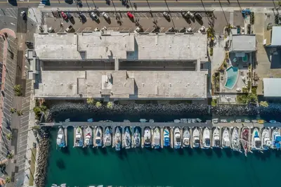 an aerial view of a river with boats at 106B New Renovation! Huge Patio with Harbor View in Oceanside