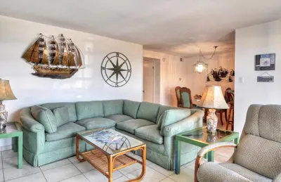 a living room with a couch and a table at 210A Marina Del Mar - Beach View in Oceanside