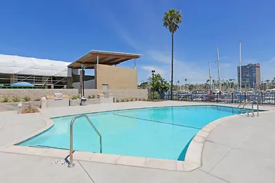 a large swimming pool in front of a building at 213A - Take a Beach Break at Marina Del Mar - Beach & Ocean Views in Oceanside
