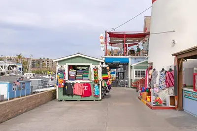 a market on a building with clothes on it at 214A - Beach and Water View, Steps to the Sand in Oceanside