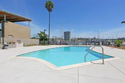 a large swimming pool in a parking lot at 305B - Seaside at the Marina - 100 Steps to the Sand in Oceanside