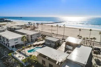 an aerial view of a beach with palm trees and buildings at 309A - Ocean and Beach View in Oceanside