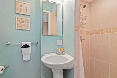 a bathroom with a sink and a shower at 309A - Ocean and Beach View in Oceanside