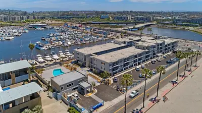 an aerial view of a marina with boats at 311B Harbor Views and Steps to the Sand in Oceanside