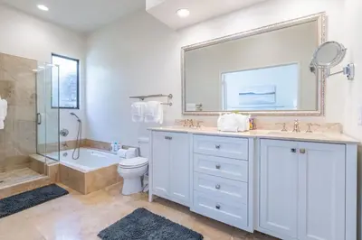a bathroom with a sink and a tub and a toilet at Water and sunset views in dreamy Cardiff by the sea in Encinitas