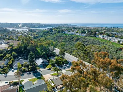 an aerial view of a town with trees at Poppy Cottage in Carlsbad