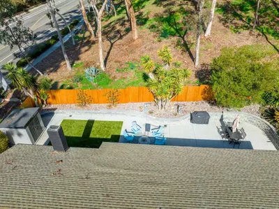 an overhead view of a garden with a table and chairs at Poppy Cottage in Carlsbad