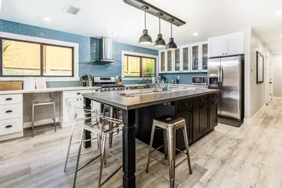 a kitchen with a large island in the middle at Poppy Cottage in Carlsbad