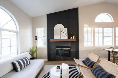 a living room with a white couch and a fireplace at Entire house - 4 Bedroom & 2 Bath, 5 Min to Beach in Oceanside