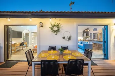 a dining room table and chairs in a living room at Entire house - 4 Bedroom & 2 Bath, 5 Min to Beach in Oceanside