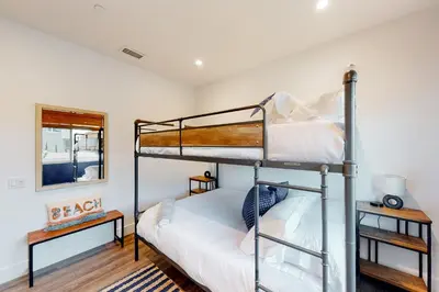 a bedroom with two bunk beds in a room at Seaside Serenity Retreat in Oceanside