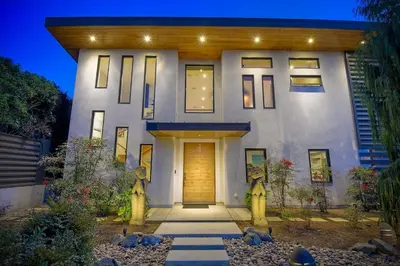 a large white house with a wooden door at Bali Hai, Luxury, High-End Encinitas Home, Large Outdoor Living Area in Encinitas