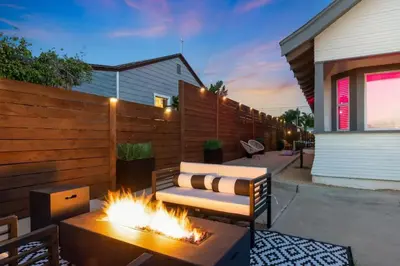a backyard with a couch and a fire pit at Sundown Sanctuary in National City in National City