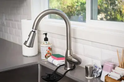 a kitchen sink with a faucet next to a window at North Park Retreat - Trendy - Tranquil - Vibrant in San Diego