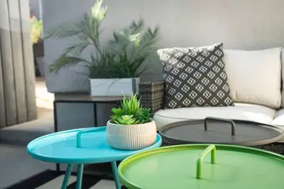 two tables in a living room with a couch at North Park Retreat - Trendy - Tranquil - Vibrant in San Diego