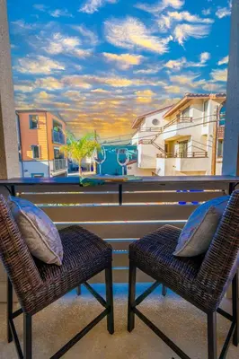 two chairs in front of a window with a view at Pristine and Luxe, Steps to Mission Beach and Bay! in San Diego
