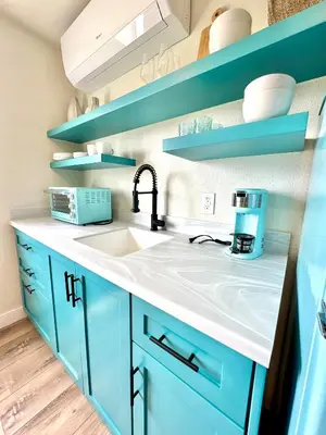 a kitchen with blue cabinets and a sink at AZUL on Avenida Del Mar (1/2 Mile to the PIER!) in San Clemente