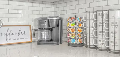 a kitchen counter with a coffee maker and cupcakes at Luxury poolside « Villa Descanso » with heated pool and Spa! Close to San Diego/ Legoland in Oceanside