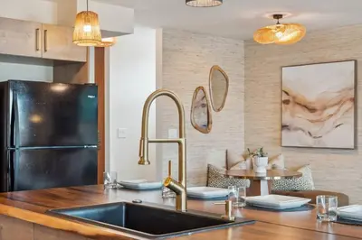 a kitchen with a sink and a refrigerator at Living Lux in La Jolla - Beach - AC - Shops in San Diego