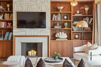 a living room with a fireplace and a tv at Living Lux in La Jolla - Beach - AC - Shops in San Diego