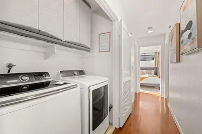 a kitchen with a stove and a dishwasher at Grand Desire - Vibrant - Luxury - Beachside treat in San Diego