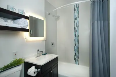 a bathroom with a sink and a shower at Hotel Aqua Mar in San Diego