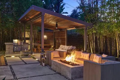 a pavilion with a fire pit in a backyard at Coastal Retreat with E-Bikes! in Carlsbad