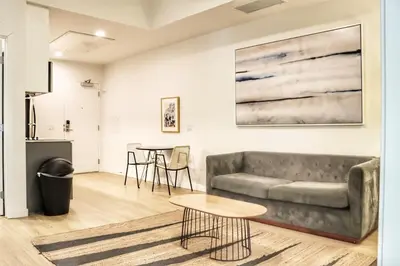 a living room with a couch and a table at Executive Escape in Downtown San Diego in San Diego