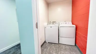 a laundry room with a washer and dryer at Fabulous Urban Retreat in San Diego in San Diego