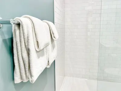 a bathroom with white towels hanging on a towel rack at Fabulous Urban Retreat in San Diego in San Diego
