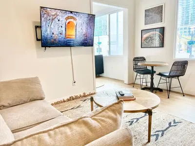 a living room with a couch and a table at Grand Downtown San Diego Apartment in San Diego