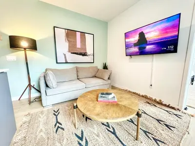 a living room with a couch and a table at Grand Downtown San Diego Apartment in San Diego