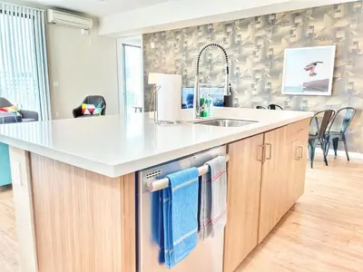 a kitchen with a sink and a counter top at 3 Bedroom Penthouse in Downtown! in San Diego