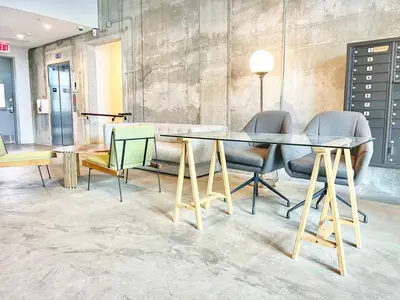 a dining room with a glass table and chairs at The Leo - One Bedroom Apartment w Private Balcony in San Diego