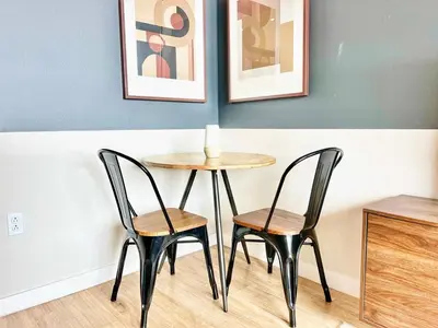 a table and two chairs in a room at Sunset Stay in Downtown San Diego in San Diego