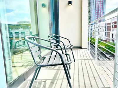 a balcony with a bench on a building at City View Apartment in Downtown! in San Diego