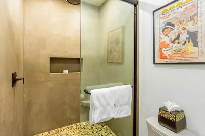 a shower with a glass door in a bathroom at Casa Real | House in La Jolla in San Diego