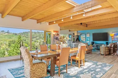 a dining room with a wooden table and chairs at Casa Real | House in La Jolla in San Diego